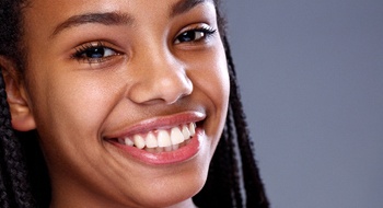 A young girl smiling