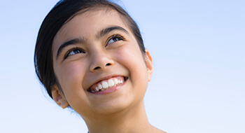 Happy young girl with beautiful smile