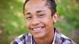Young man smiling with braces