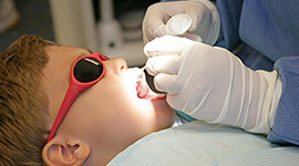 Young boy receiving dental sealants