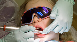 Relaxed child receives dental care