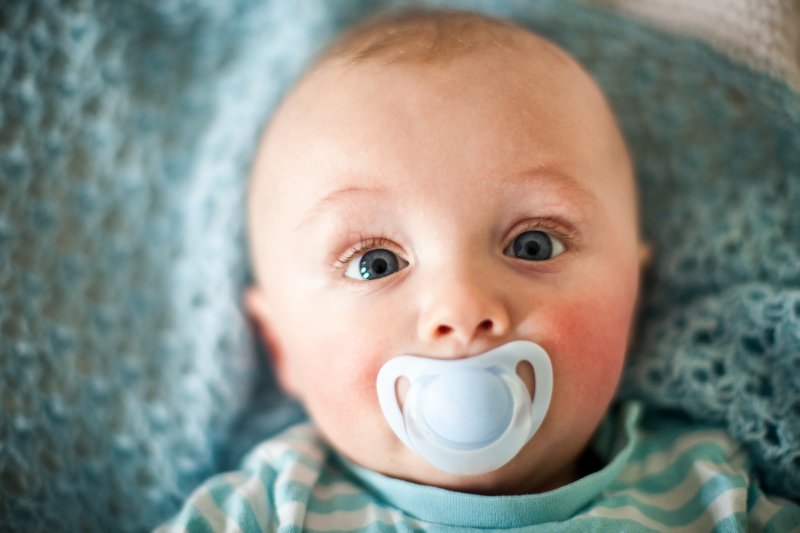 baby with pacifier in Bergenfield