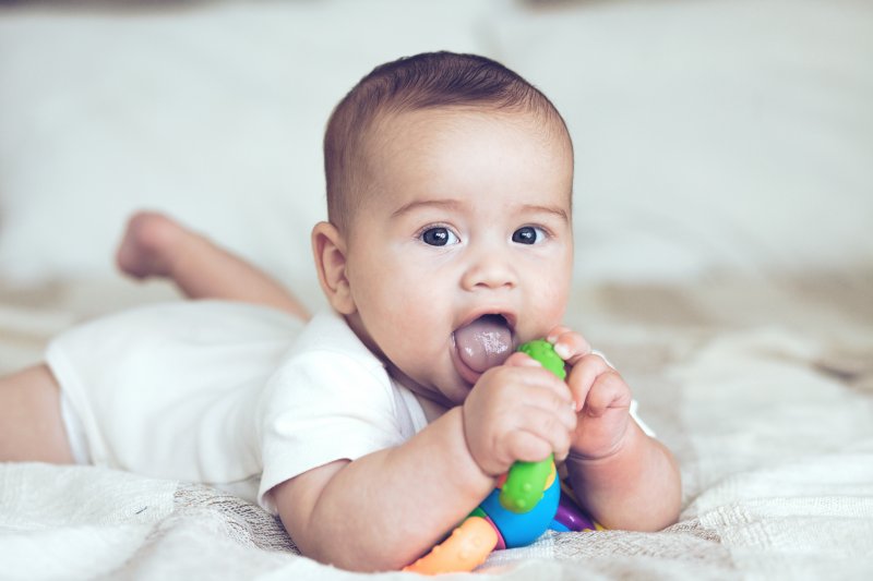 a baby playing with a toy